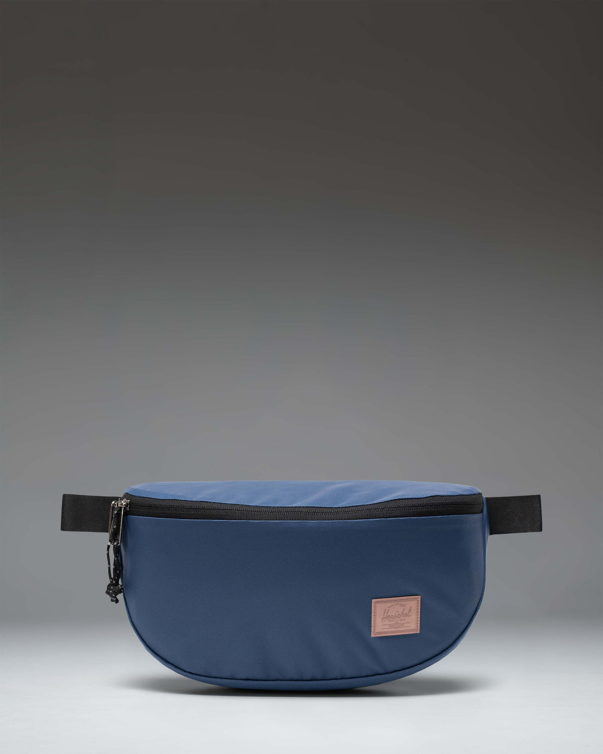 Herschel Supply Co. Kaine Hip Pack in Oceana blue, a functional waist bag with zippered pockets and adjustable strap.