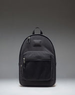 Herschel Supply Co. Kaine Backpack in black, showing the front view with zippered pockets and mesh side pockets.