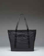 Herschel Heritage Tote Bag in Black, showcasing its classic design and iconic diamond detail on the front.