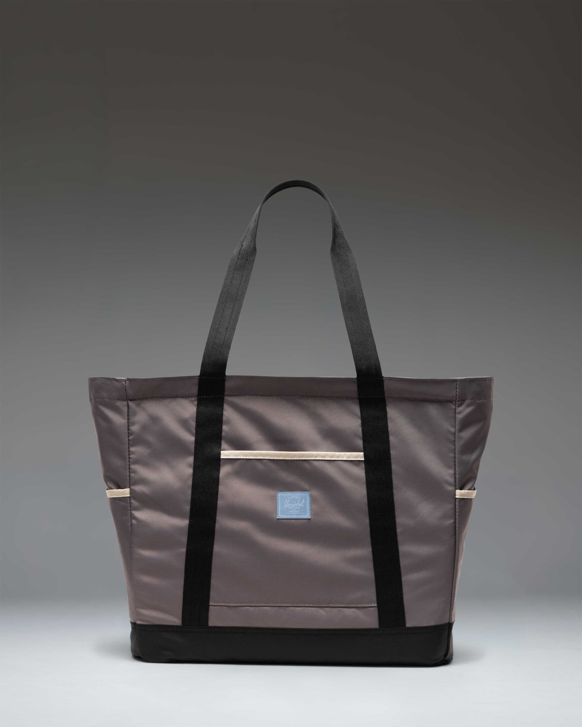 Herschel Heritage Tote bag in Dark Gull Gray, featuring a classic canvas design with a durable base and top carrying handles.
