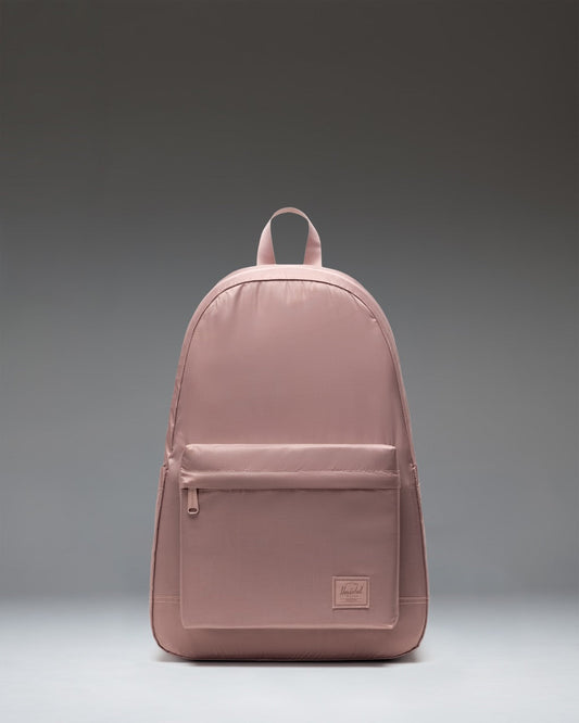 Herschel Supply Co Rome Packable Backpack in Ash Rose Tonal, shown packed down into its own internal pocket for compact storage.