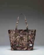 Herschel Heritage Tote bag in Realtree APX camouflage pattern with top-carrying handles and front pocket.