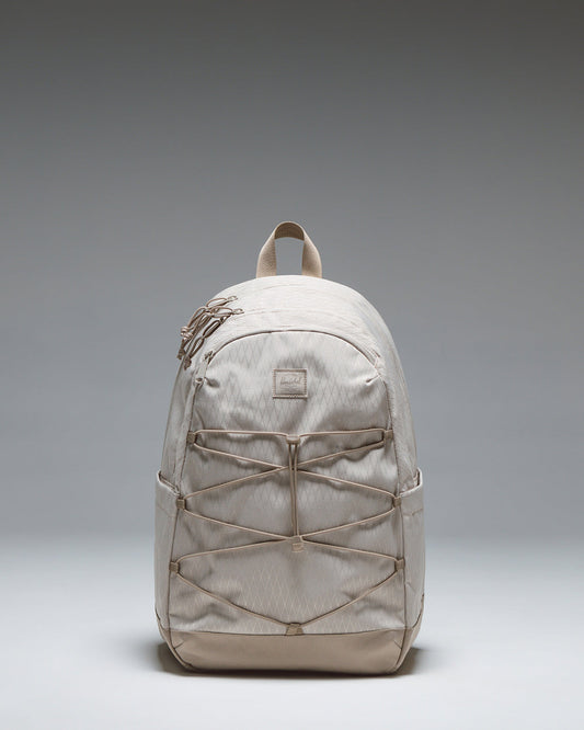 Herschel Supply Co. Kingston Backpack in French Oak Diamond/Cobblestone showing its athletic silhouette and front bungee cord system.
