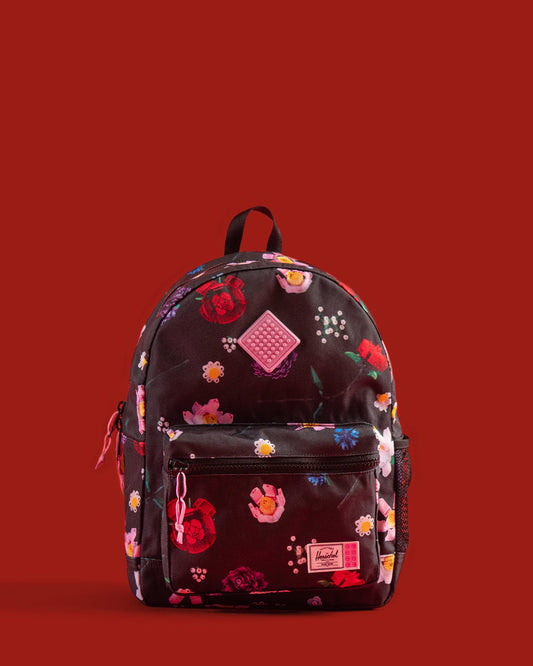 LEGO Herschel Heritage Kids Backpack in Falling Florals color, featuring a vibrant floral pattern with LEGO brick graphics.