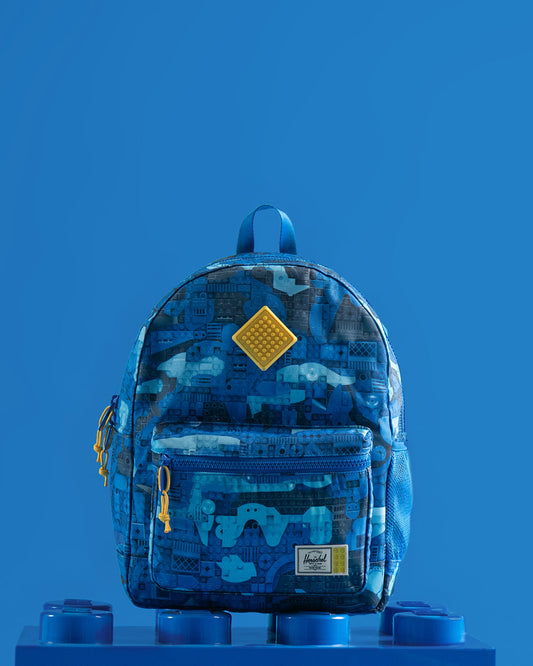 Herschel Supply Co. Herschel Heritage Kids Backpack in Abstract Bricks Blue featuring a colorful LEGO brick print design.