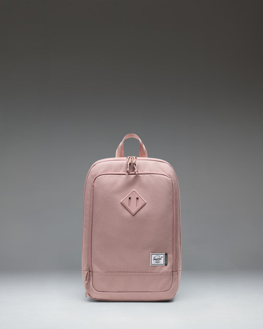 Herschel Heritage Shoe Bag in Ash Rose pink, featuring a main zipper closure, a convenient side handle, and the classic Herschel woven label.