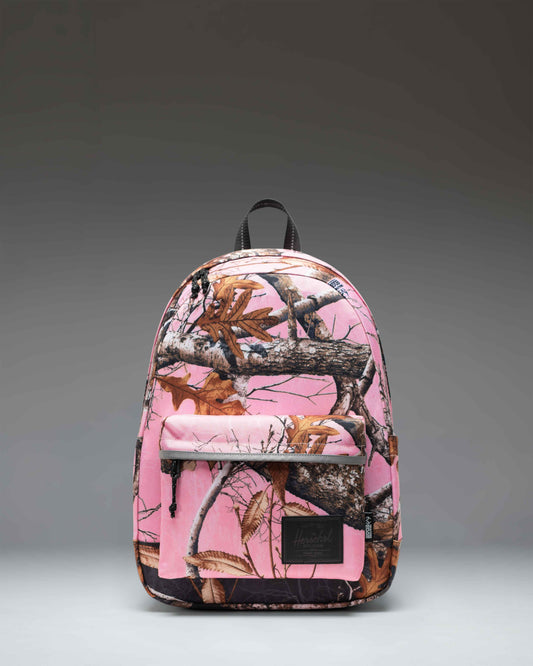 Herschel Classic Backpack in Realtree Edge Camo Pink/Black featuring a vibrant pink and black camouflage pattern and front pocket.
