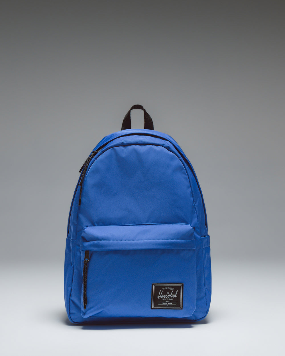 Herschel Classic XL Backpack Twill in Dazzling Blue, featuring a clean, minimalist design with a front storage pocket and zipper closures.