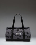 Thrasher Herschel Heritage Skate Duffle Nylon bag in Asphalt Black Destroy, featuring custom prints and skate straps.