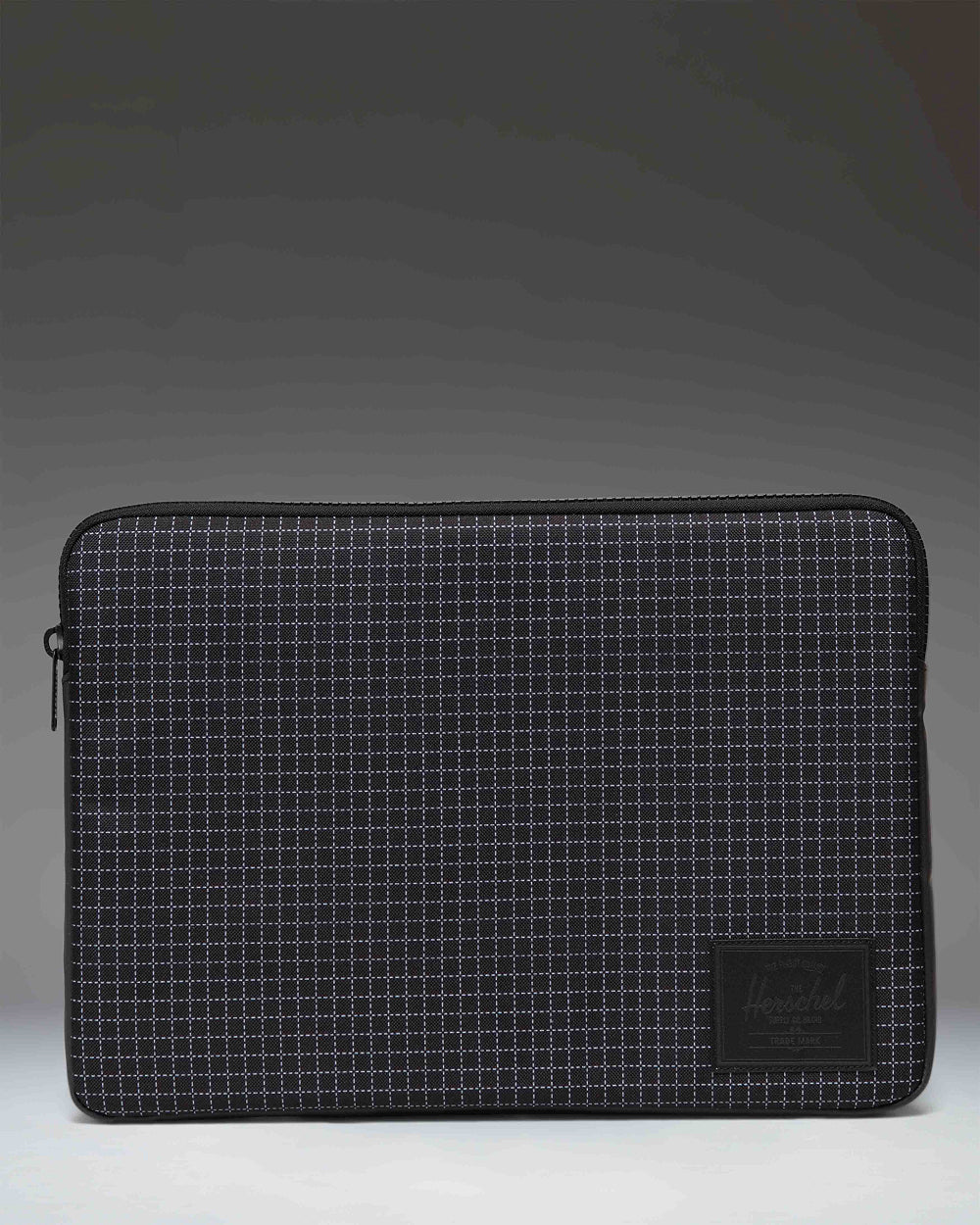 Herschel Anchor 15-16 Inch Laptop Sleeve in Grid Black/Black, showing the clean front design with a subtle grid pattern and classic logo label.