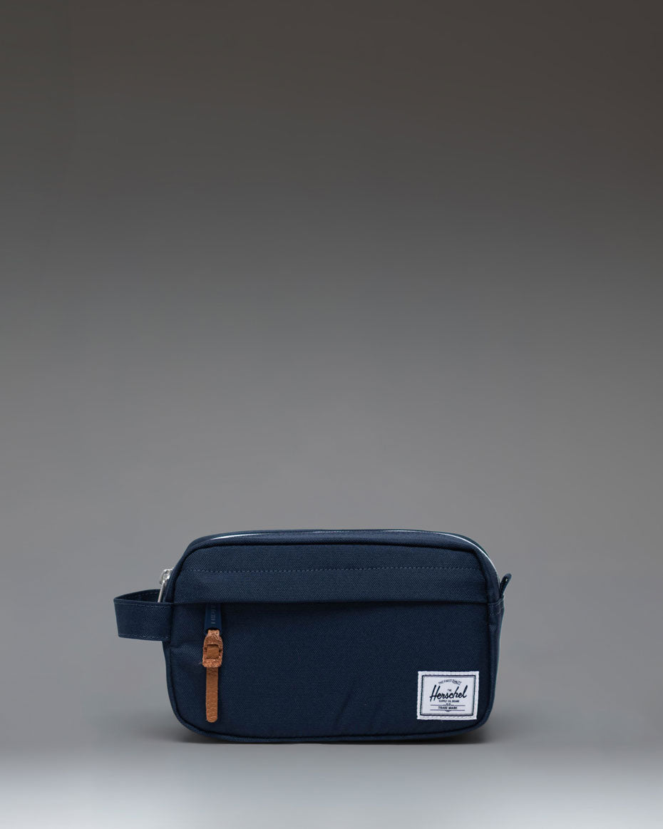 Herschel Supply Co. Chapter Small Travel Kit in navy blue, shown from a front angle perspective.