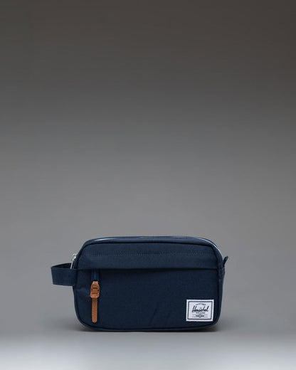 Herschel Supply Co. Chapter Small Travel Kit in navy blue, shown from a front angle perspective.