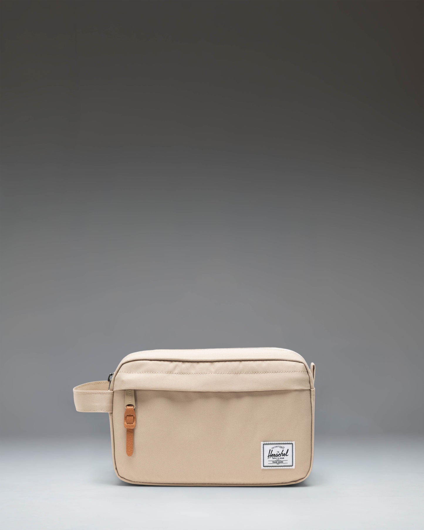 Herschel Supply Co. Chapter Travel Kit in Eucalyptus, a compact green toiletry bag with a convenient side carrying handle.