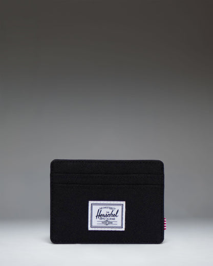Herschel Supply Co. Charlie Cardholder wallet in solid black featuring multiple card slots and the signature woven label.