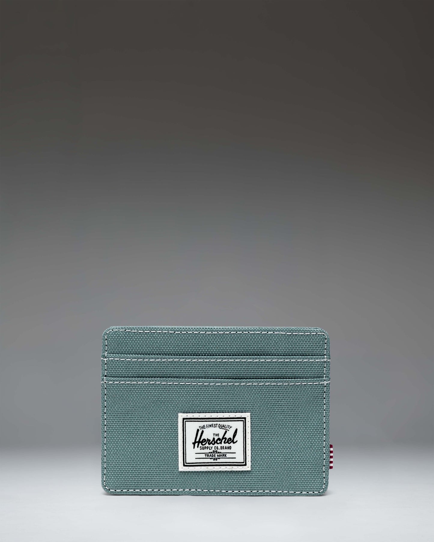 Herschel Supply Co. Charlie Cardholder wallet showcasing its slim design, multiple card slots, and signature brand logo.