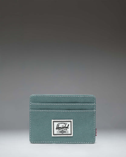 Herschel Supply Co. Charlie Cardholder wallet showcasing its slim design, multiple card slots, and signature brand logo.