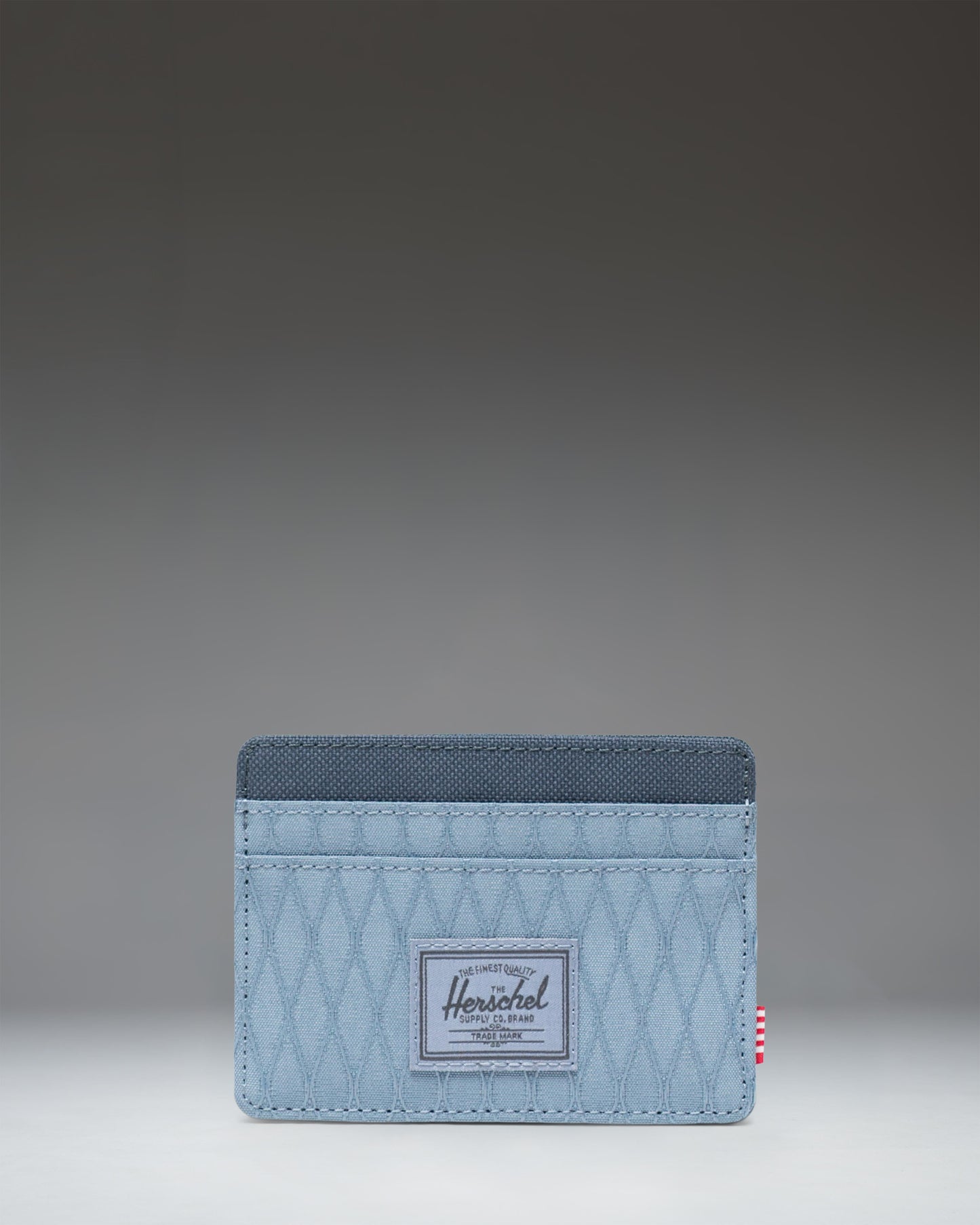 Herschel Supply Co. Charlie Cardholder in Blue Mirage Diamond/Sea Storm, showing multiple card slots and top storage sleeve.