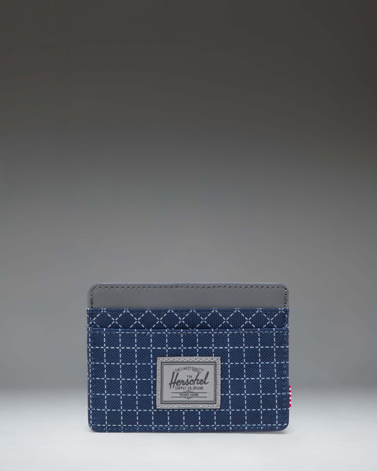 Herschel Supply Co. Charlie Cardholder in Grid Naval Academy/Magnet, featuring a sleek, minimalist design with multiple card slots.