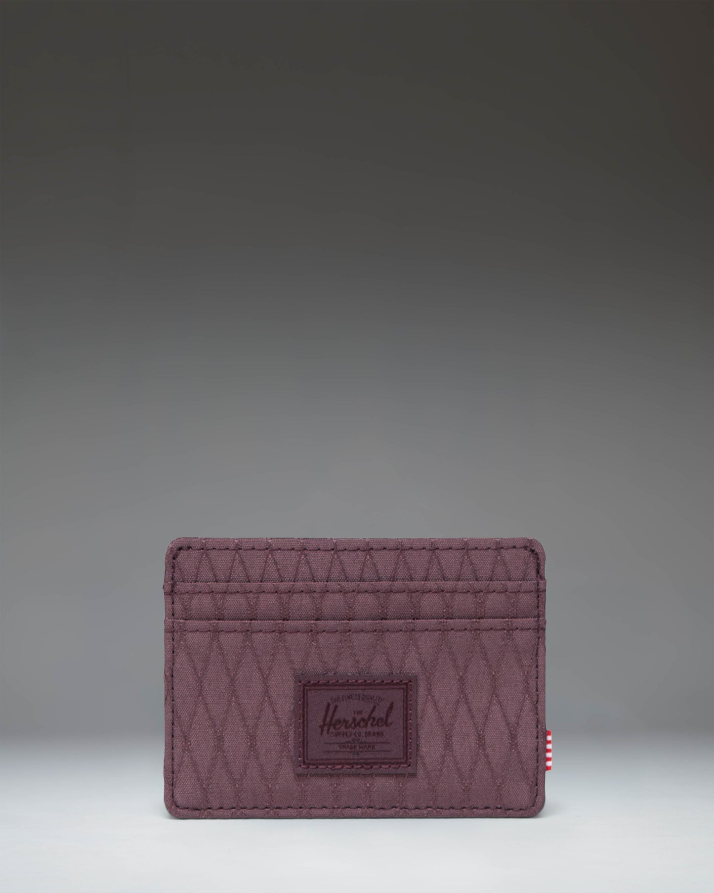 Herschel Supply Co. Charlie Cardholder wallet in Huckleberry Diamond, showcasing its slim design and multiple card slots.