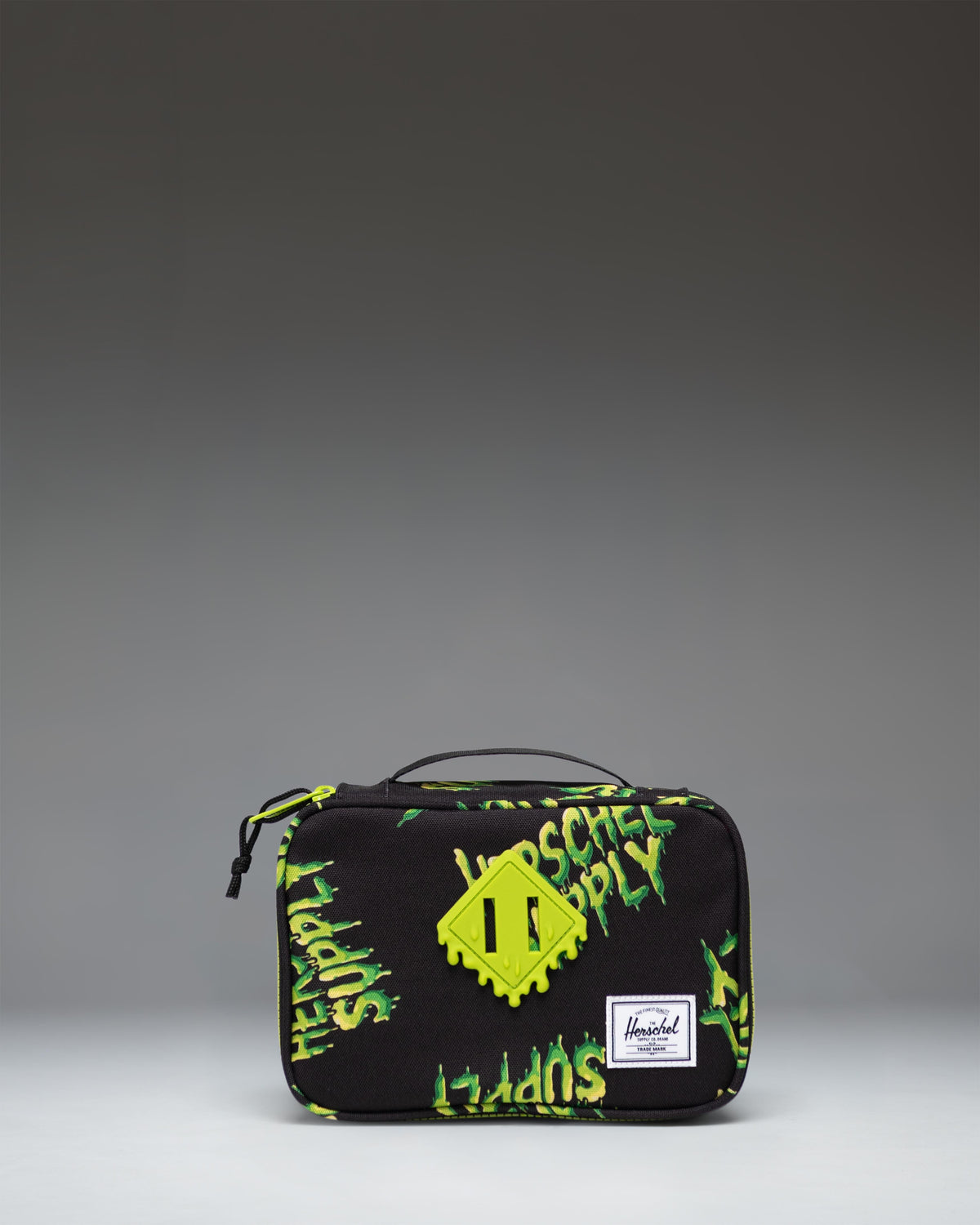 Herschel Supply Co. Heritage Pencil Case Little Herschel in HSC Slime green, showcasing the front view with a classic logo patch.