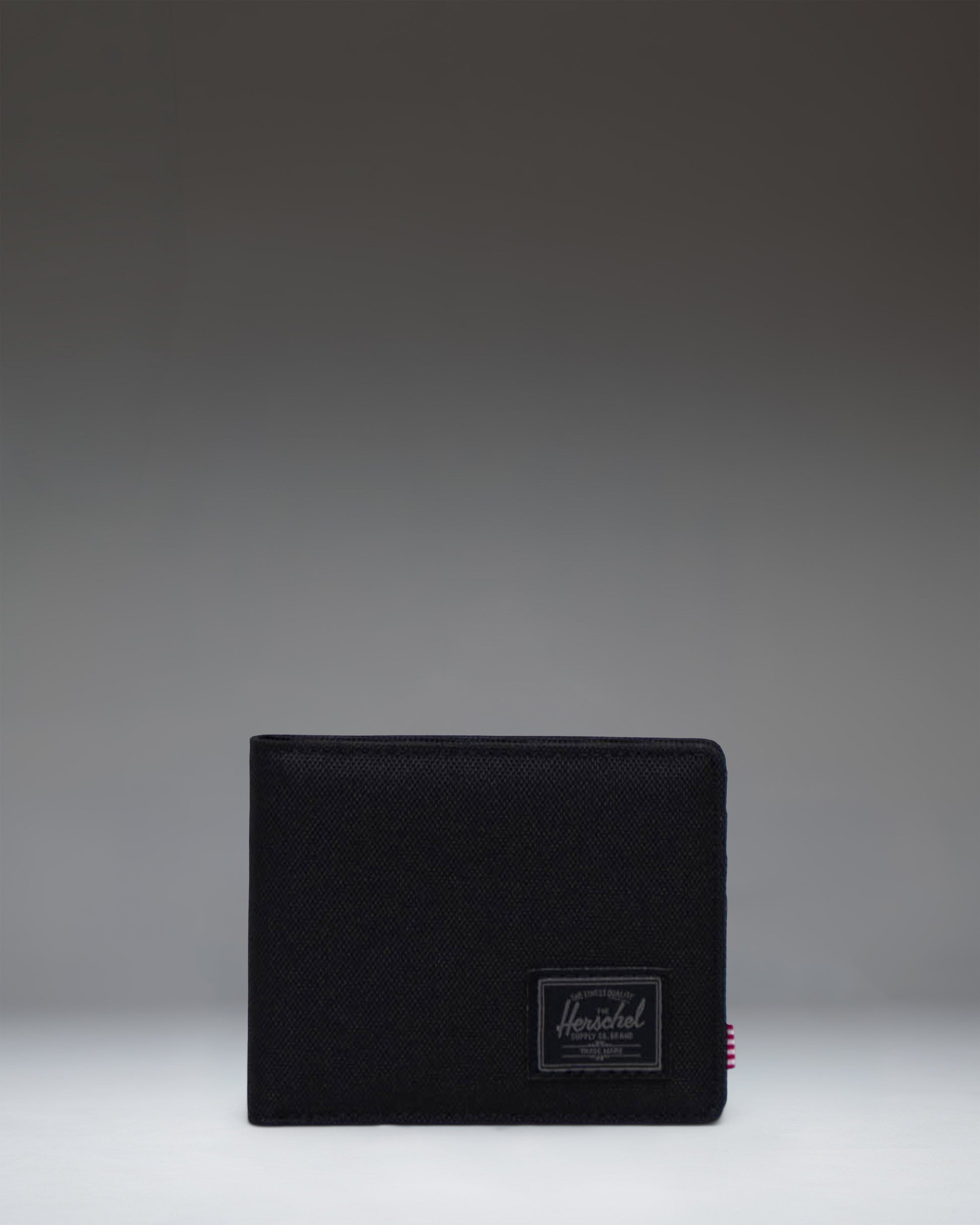 Herschel Supply Co. Roy Wallet in Black Tonal, showing the classic bi-fold design.