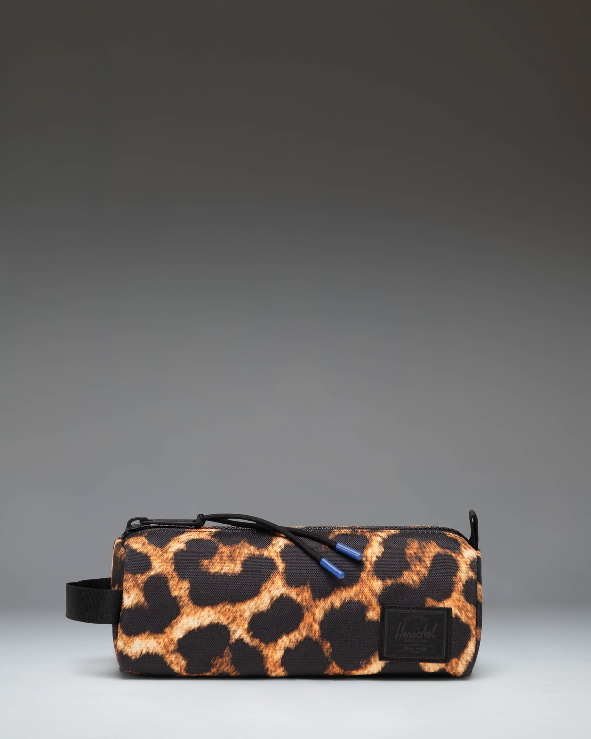 Herschel Supply Co. Settlement Pencil Case in the Digi Leopard Light Large pattern featuring a zippered main compartment and side carrying handle.