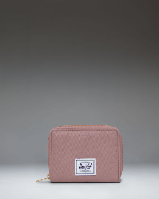 Herschel Supply Co. Tyler Wallet in Ash Rose, a compact zippered wallet showing its light pink exterior.