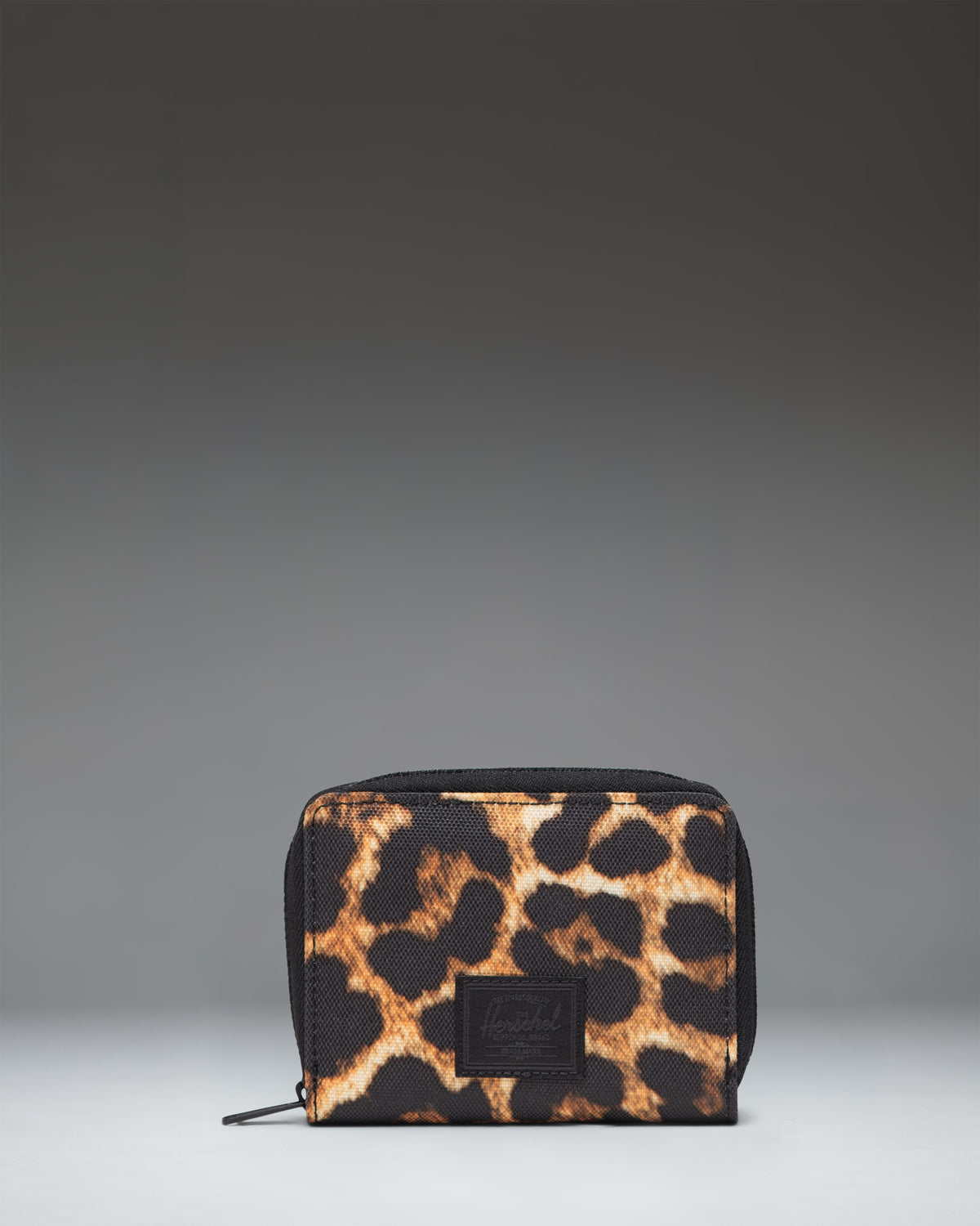 Herschel Supply Co. bifold Tyler Wallet in the digi leopard print pattern with a zippered closure.