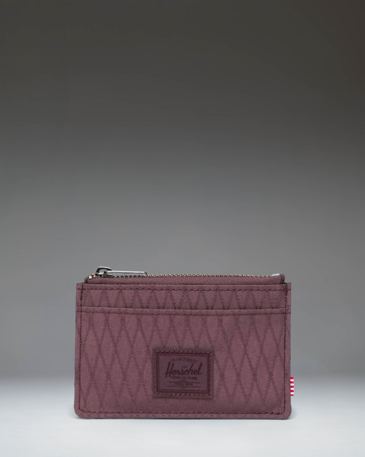 Herschel Supply Co. Oscar Cardholder in Huckleberry Diamond, showing the compact wallet design with multiple card slots.