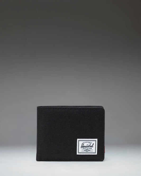 Black Herschel Supply Co. Roy Coin Wallet bi-fold design showing the clean front exterior with the classic woven label.