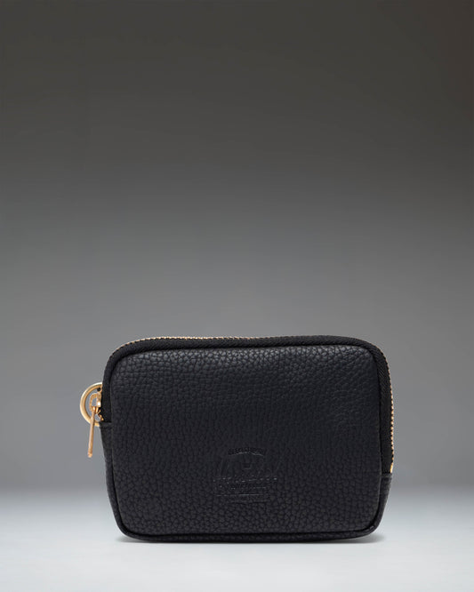Herschel Supply Co. Oxford Pouch in black vegan leather, featuring a sleek, zippered design for organizing small essentials.