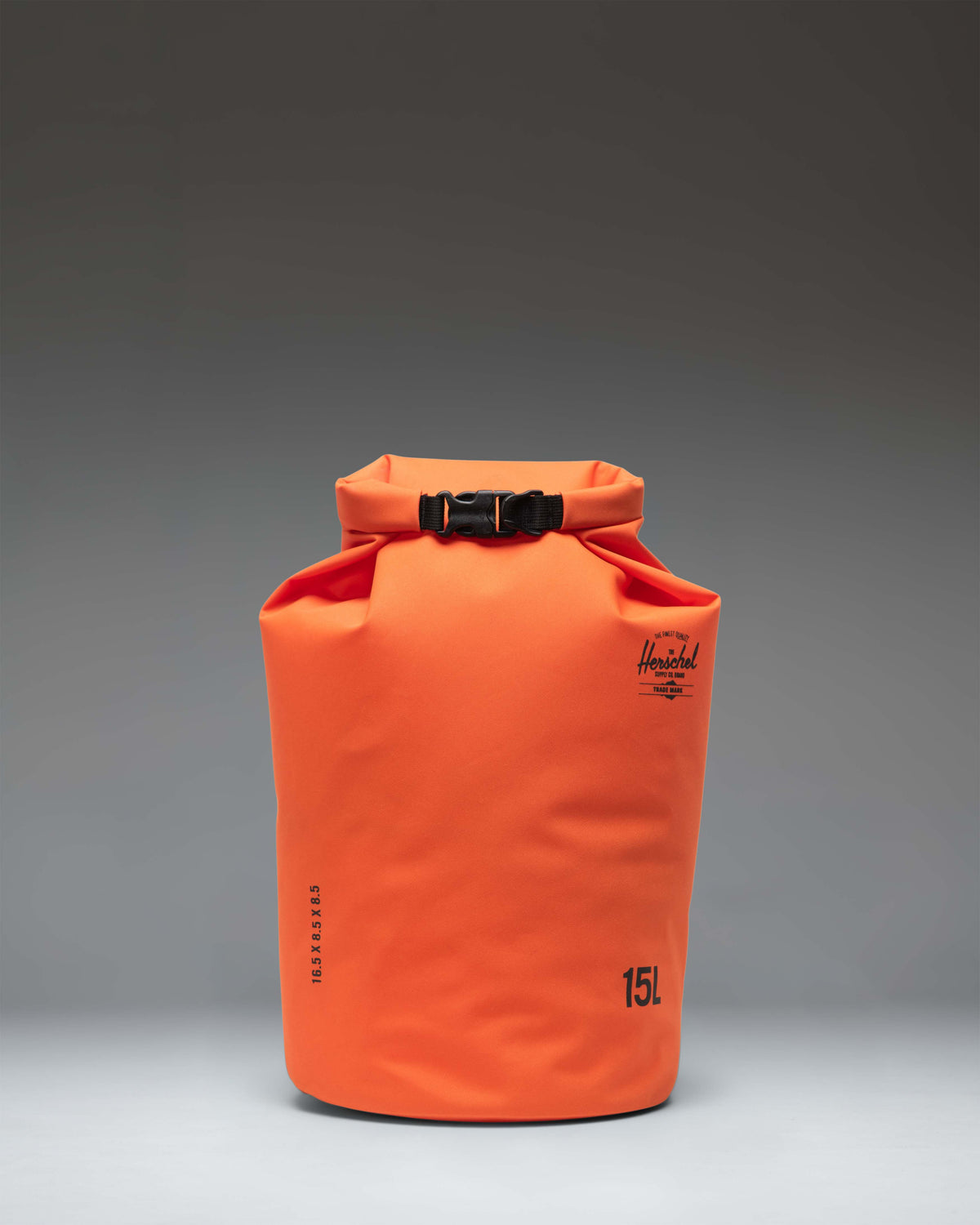 Herschel Supply Co. Dry Bag Organizer 15L in Vermillion Orange, showing a front view of the bright orange roll-top waterproof bag.