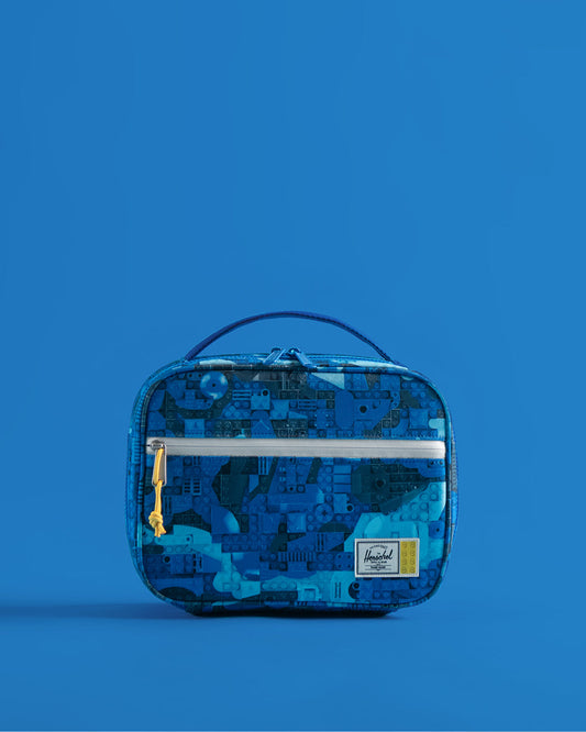 Herschel Supply Co. LEGO Pop Quiz Lunch Box in Abstract Bricks Blue, featuring a vibrant LEGO brick pattern with insulated main compartment.