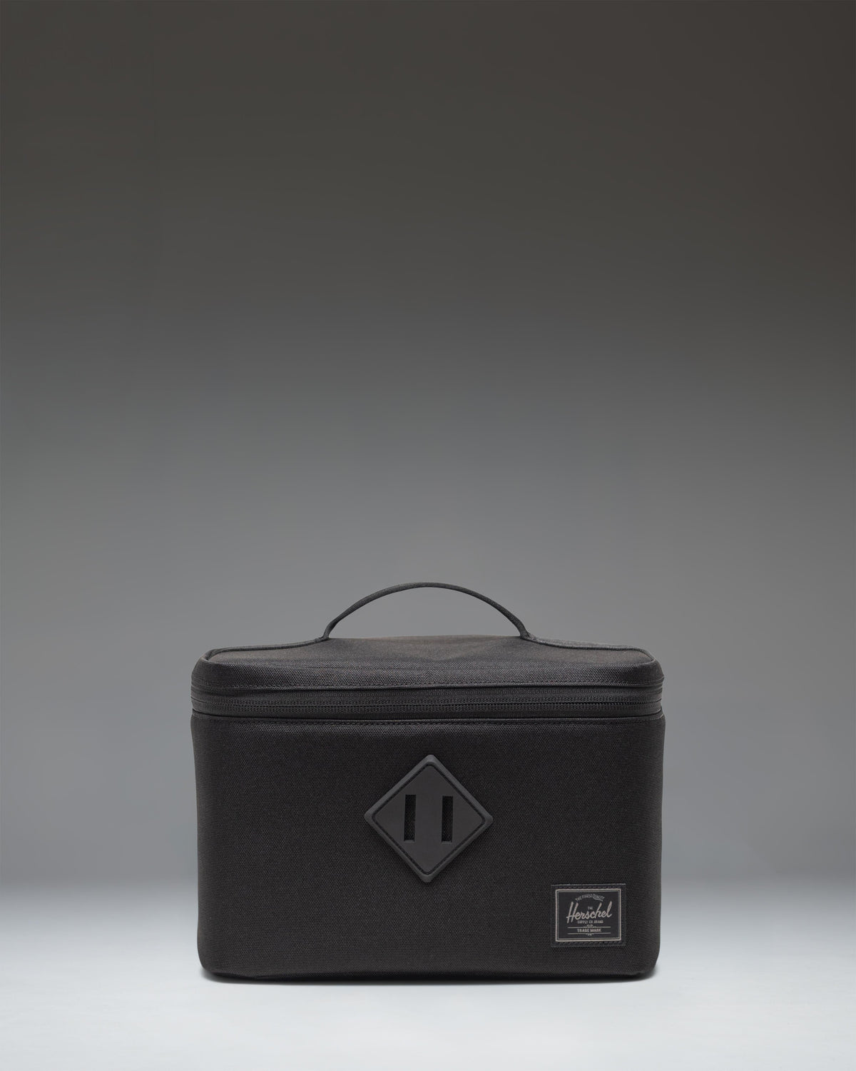 Black Herschel Heritage Lunch Box featuring a zippered front pocket and classic Herschel woven label.
