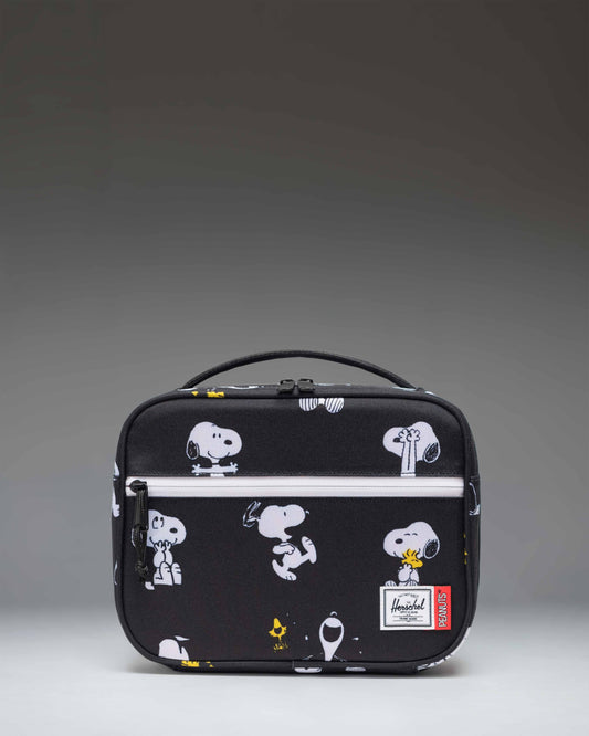 Herschel Supply Co. Peanuts Pop Quiz Lunch Box in Snoopy and Woodstock Black featuring a repeating pattern of Snoopy sleeping on his doghouse.