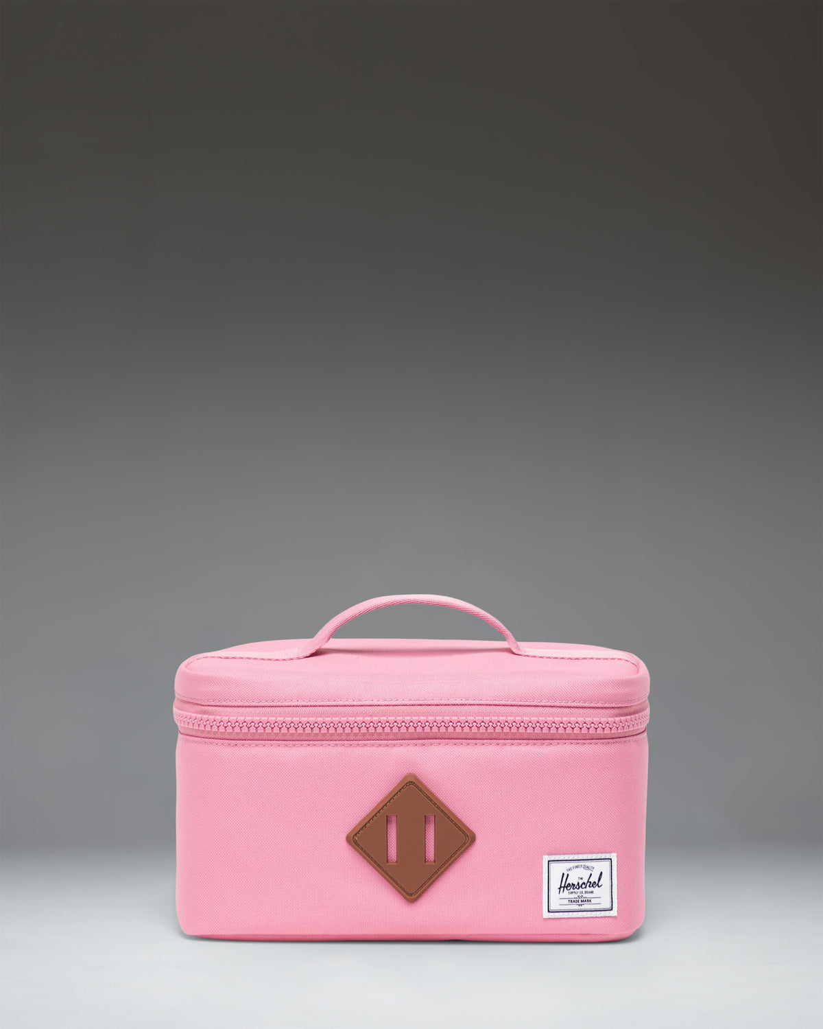 Herschel Heritage Lunch Box Little Herschel in Cashmere Rose pink featuring a signature diamond detail and convenient top-carrying handle.