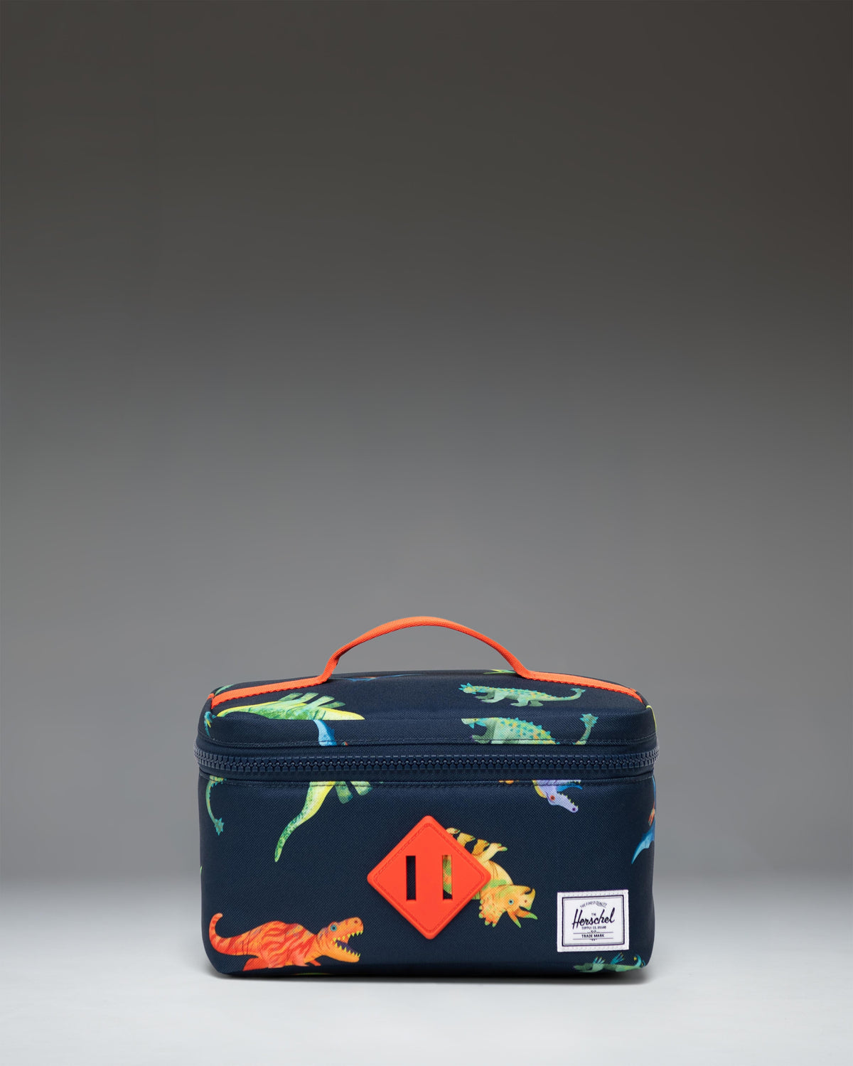 Herschel Heritage Lunch Box Little Herschel in Water Colour Dinosaurs Darkest Navy, featuring a colorful dinosaur pattern on a dark navy background.