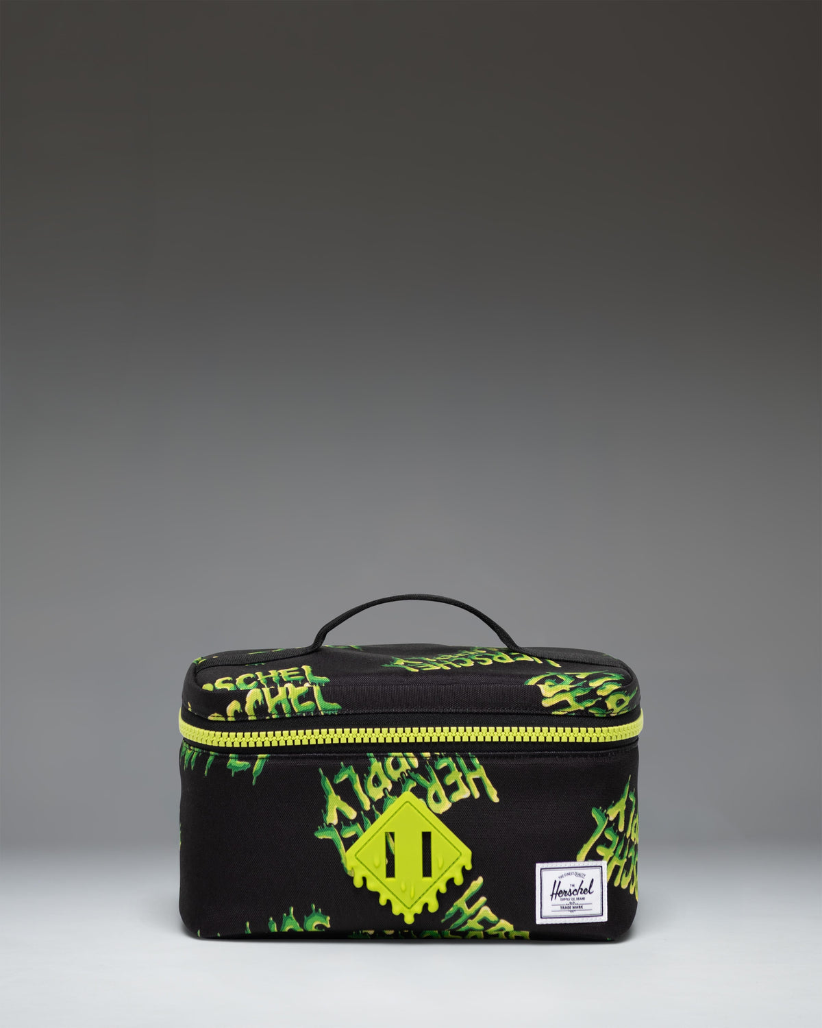 Herschel Heritage Lunch Box Little Herschel in bright HSC Slime green featuring a front storage pocket and a rubber diamond accent.