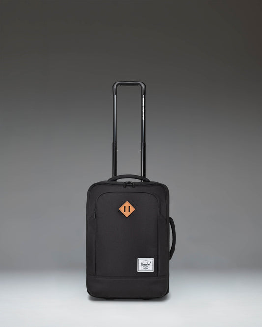 Herschel Heritage Softshell Large CarryOn Luggage in Black, showcasing a durable exterior, sleek wheels, and a sturdy telescoping handle.