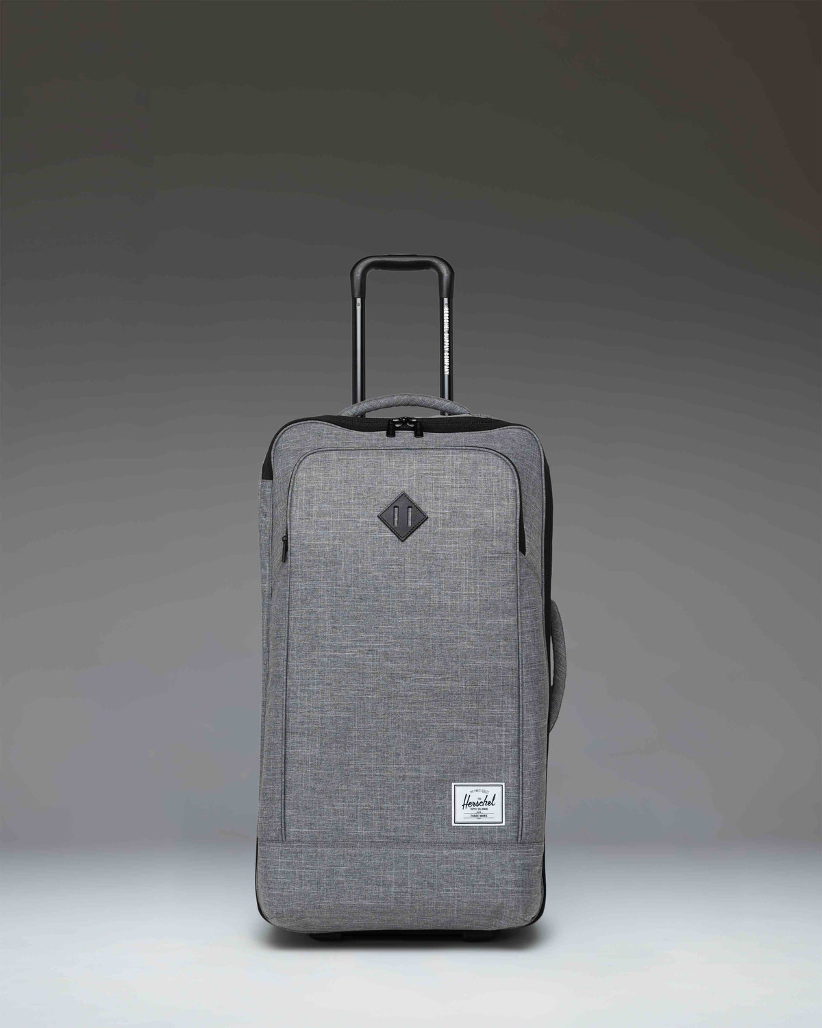 Herschel Heritage Softshell Medium Luggage in Raven Crosshatch, a textured grey wheeled suitcase.