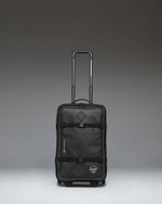 Herschel Supply Co. All Season Hybrid Roller Bag Large Carry On in black, showing the front exterior view of the luggage.
