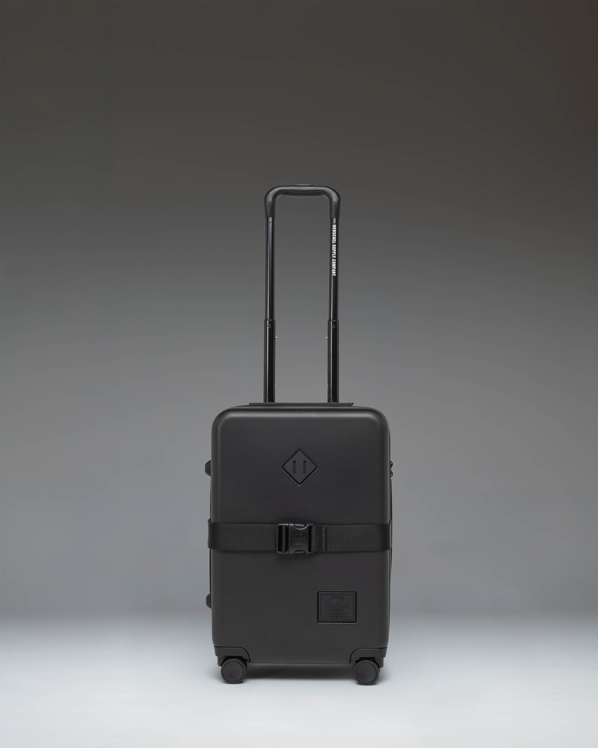 Black Herschel Heritage Hardshell Large Carry On Exp suitcase in Black, front view.