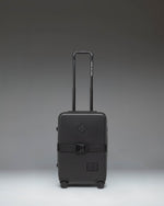 Black Herschel Heritage Hardshell Large Carry On Exp suitcase in Black, front view.