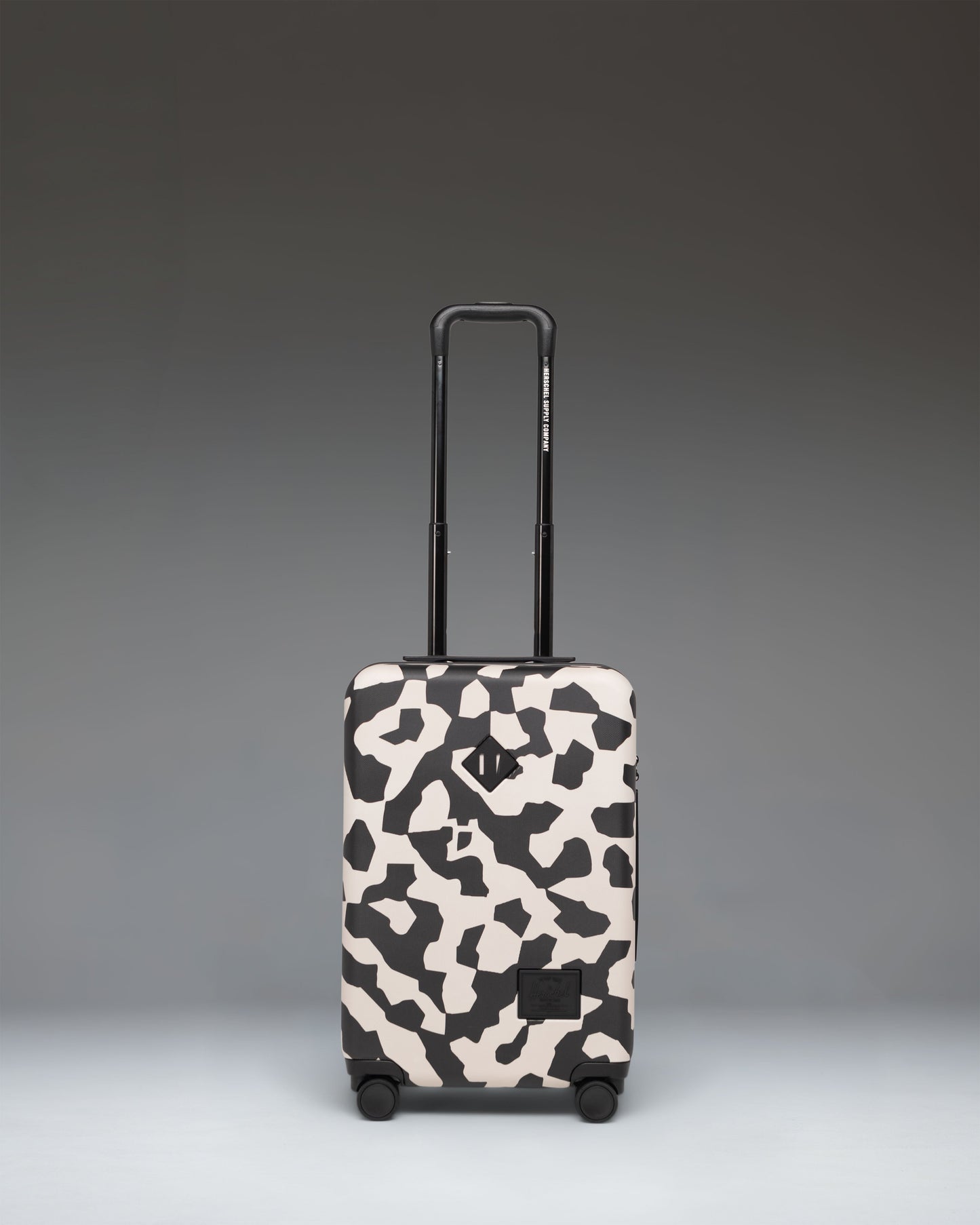 Herschel Heritage Hardshell Large CarryOn Luggage in Shadow Pixel Moonbeam color pattern.