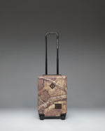 Herschel Heritage Carry On Luggage in Realtree APX Camo pattern, showing the front view with a black zipper and signature logo label.