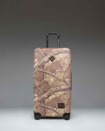 Realtree Herschel Heritage Large Luggage in Realtree APX Camo.