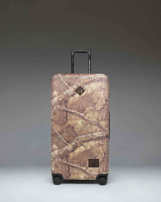 Realtree Herschel Heritage Large Luggage in Realtree APX Camo.