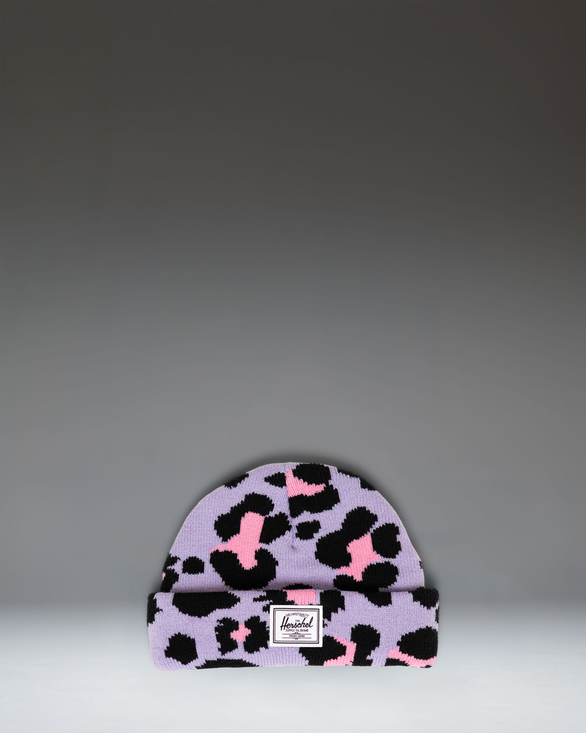 Herschel Supply Co. Elmer Baby Graphic Beanie 0–6 Months in Scribble Leopard Sachet Pink, featuring a pink knit hat with a black leopard print.