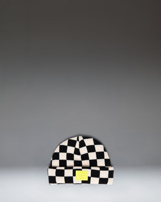 Herschel Supply Co. Elmer Baby Graphic Beanie 0–6 Months in a black and white checkerboard pattern.