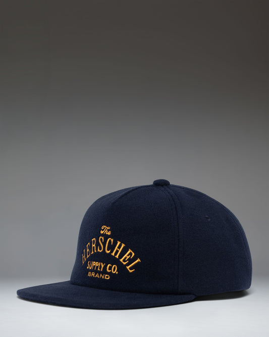 Herschel Supply Co. Scout Heritage Cap in Darkest Navy, a classic six-panel baseball hat with an adjustable strap back.
